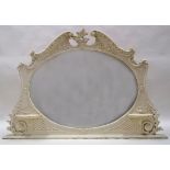 A Victorian over mantel mirror with Rococo frame and two brackets,