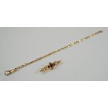 A 9 carat gold bracelet, of fetter and three links, 20 cm long; with a garnet set brooch,