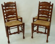 A set of four mahogany ladder back chairs with rush seats,