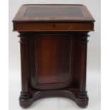 A Victorian rosewood Davenport with canvas inset top,