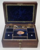 A Victorian rosewood sewing box with inset mother of pearl shield to the top,
