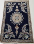 A late 20th century rug with central medallion and flower and urn spandrels,