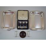 A cased set of six silver tea spoons; with a plated entree dish; a pair of knife rests;