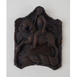 A carved oak wall plaque, in the form of a soldier on horseback, 31cm high,