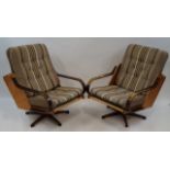A pair of Slatte-Gungan armchairs each with adjustable bases,