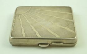 An Art Deco silver square cigarette case, engine turned with a corner sunburst motif,