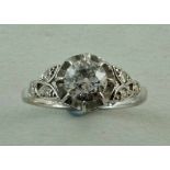 A diamond single stone ring, stamped '18ct & Plat', the transitional cut stone of approximately 0.