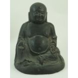 A bronze figure of Buddha seated on a domed base,