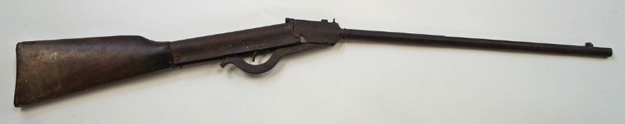 A 20th century air rifle with a walnut stock,