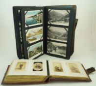 A Victorian red leather bound photograph album along with a collection of postcards mostly U.