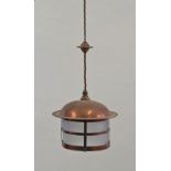 Two copper framed hanging lanterns, one of tapering rectangular form,