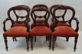 A set of six Victorian style mahogany dining chairs with balloon backs,