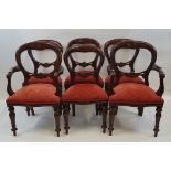 A set of six Victorian style mahogany dining chairs with balloon backs,