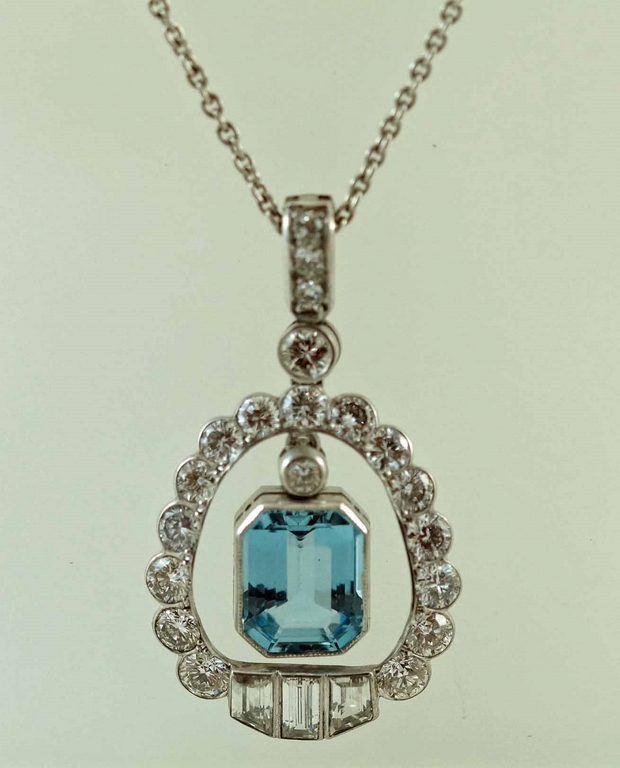 An aquamarine and diamond pendant and chain,