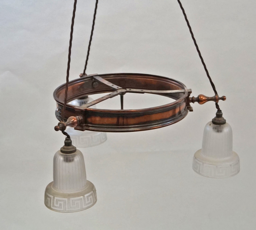 An early 20th century adjustable hanging ceiling light the cooper band suspending three frosted