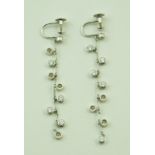 A pair of Dior diamond drop earrings, stamped to the screw fitting 'Dior', 'FB0789' and '750',