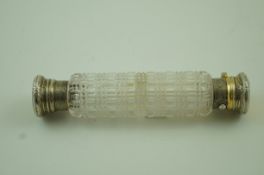 A Victorian silver gilt mounted clear cut glass double ended scent bottle
