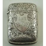A late Victorian silver vesta case, Birmingham 1894, of unusual engraved form,