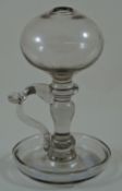 A late 18th century glass lace makers lamp with bulbous top and knopped stem,