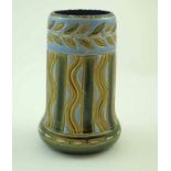 A Royal Doulton pottery vase of cylindrical form with incised decoration with blue and green glazes,