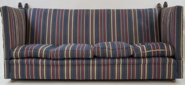 A 20th century Knowle sofa with turned acorn finials and striped upholstery, 213cm wide,