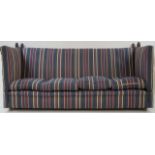 A 20th century Knowle sofa with turned acorn finials and striped upholstery, 213cm wide,