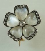 A moonstone and diamond flower brooch,