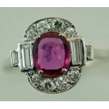 A oval cut ruby and diamond cluster ring, the oval cut, stated as being 1.