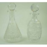 A cut glass decanter and stopper of flared form, 28cm high and another of barrel form,