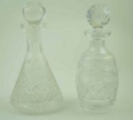 A cut glass decanter and stopper of flared form, 28cm high and another of barrel form,