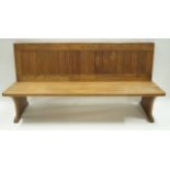 An oak bench with double panelled back, maximum 89.