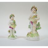 An 18th century Derby porcelain figure of a putti holding a basket of flowers,