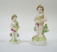 An 18th century Derby porcelain figure of a putti holding a basket of flowers,