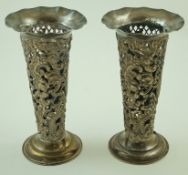 A pair of late Victorian silver pierced and embossed vases, London 1892 by William Comyns,
