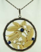 A German silver, ivory and lapis lazuli pendant, circa 1930,