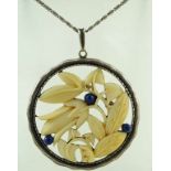 A German silver, ivory and lapis lazuli pendant, circa 1930,