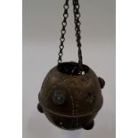 An eastern brass hanging lantern, set with glass cabochons,
