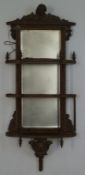 A Victorian wall mirror with three tier shelves, overall 100cm high, 42.