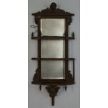 A Victorian wall mirror with three tier shelves, overall 100cm high, 42.