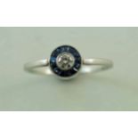 A diamond and calibre sapphire ring, the white mount unmarked, the brilliant cut of approximately 0.