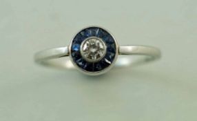A diamond and calibre sapphire ring, the white mount unmarked, the brilliant cut of approximately 0.