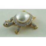 An articulated pearl and diamond brooch in the form of a turtle,