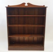 A mahogany standing bookcase with adjustable shelves on plinth base, 151cm high, 121cm wide, 34.