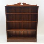 A mahogany standing bookcase with adjustable shelves on plinth base, 151cm high, 121cm wide, 34.