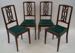 A set of four Edwardian mahogany and satinwood banded chairs with pierced splat,