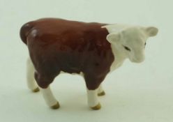 A Beswick figure of a Hereford calf, printed factory marks in black, 9.