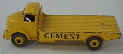 A Dinky toy Leyland comet yellow flatbed truck