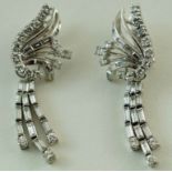 A pair of diamond drop earrings, with baguette and round cut diamonds, with detachable drops,