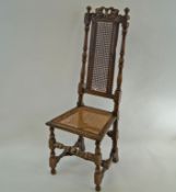 A Daniel Marot style chair with caned back and seat on turned legs linked by a stretcher