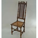 A Daniel Marot style chair with caned back and seat on turned legs linked by a stretcher